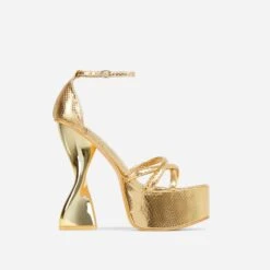EGO Sweetner Strappy Open Toe Platform Twisted Statement Heel In Gold Metallic Croc Print Faux Leather