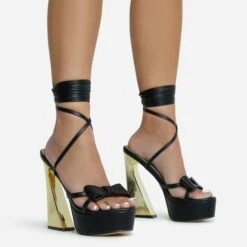 EGO Driving-Me-Crazy Lace Up Bow Detail Platform Metallic Flared Block Heel In Black Faux Leather