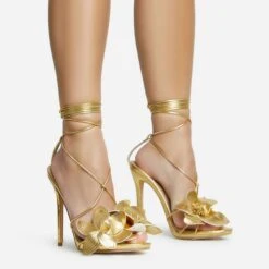 EGO Blooming Lace Up Flower Detail Platform Stiletto Heel In Gold Faux Leather