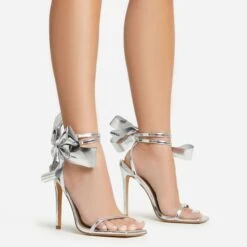 EGO Beau Oversized Bow Detail Square Toe Stiletto Heel In Silver Faux Leather