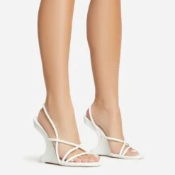 EGO Thriller Strappy Detail Square Toe Sling Back Cut Out Wedge Heel In White Faux Leather -EGO shop 30 11 22 fw39900 s